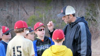 Craig Edwards coaches his son's baseball team