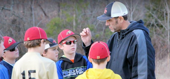 Craig Edwards coaches his son's baseball team