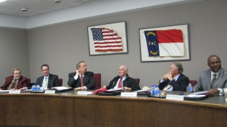 Dula (far left) served as town manager for 23 years