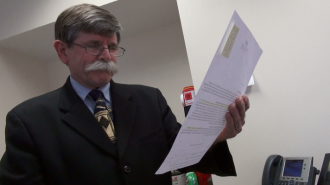 Dr. Chris Davis was shocked to find that his health insurance program had been dropped, due to the Affordable Care Act.