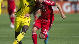 Lovitz fights off a defender in a match against the Columbus Crew on May 31. Photo Courtesy of Paul Giamou and Toronto F.C.
