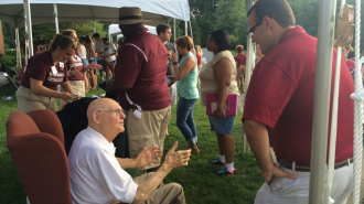 7:57 a.m.- Dr. Danieley chats with students outside of the Danieley Center.