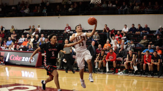 Elon guard Dainan Swoope goes up for a layup in a win over Belmont Abbey. (Andrew Feather/ELN)